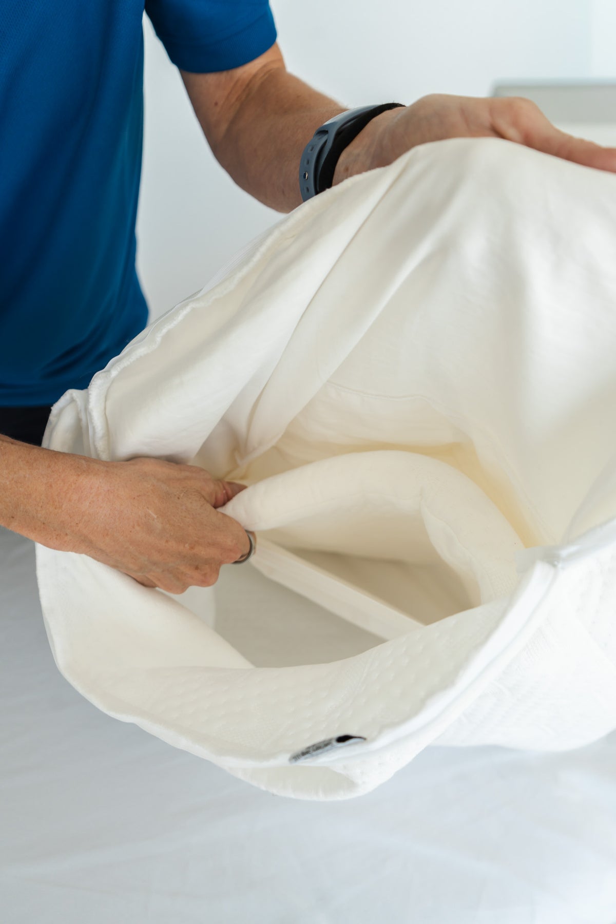 Sliding a Crown Lift support core into its pocket pillowcase